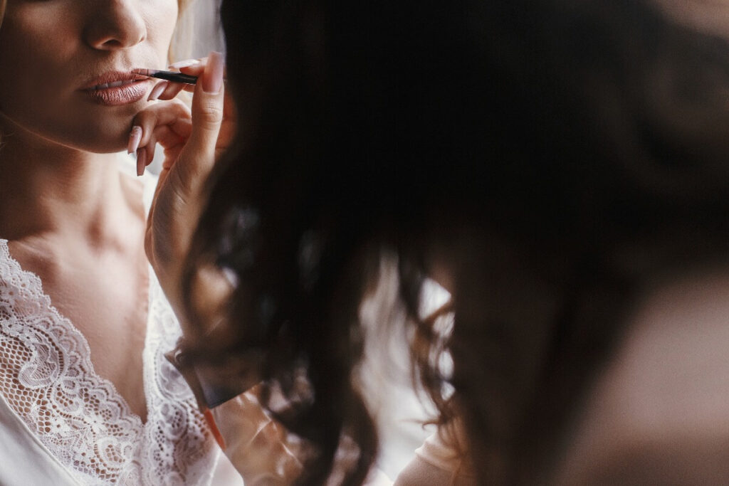 Makeup artist preparing a bride for her wedding