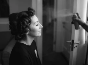 Bride getting ready with classic Hollywood waves pinned in place