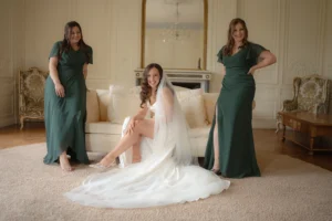 Bride and her bridesmaids sharing a joyful moment before the ceremony