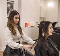 izabella cutting hair at the salon in london