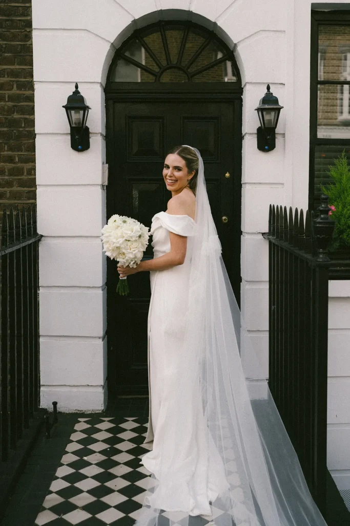 Bride smiling outside her London wedding venue