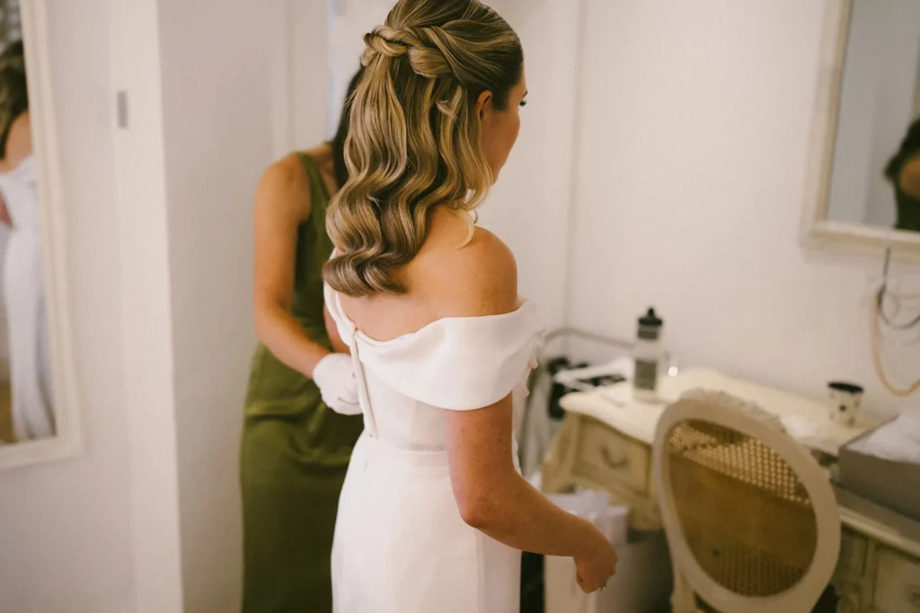 Detailed view of a bride's elegant hairstyle with braids and curls