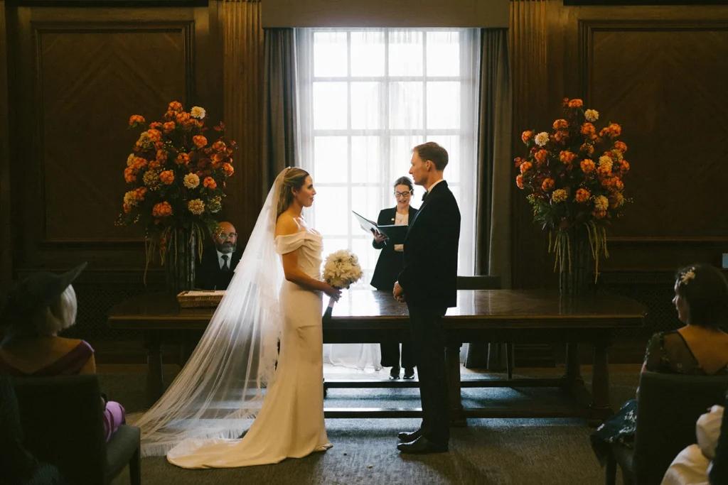 Bride and groom exchanging vows at London wedding ceremony