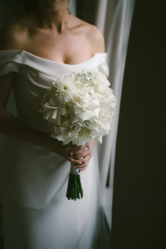Bride holding a stunning white wedding bouquet close-up in London