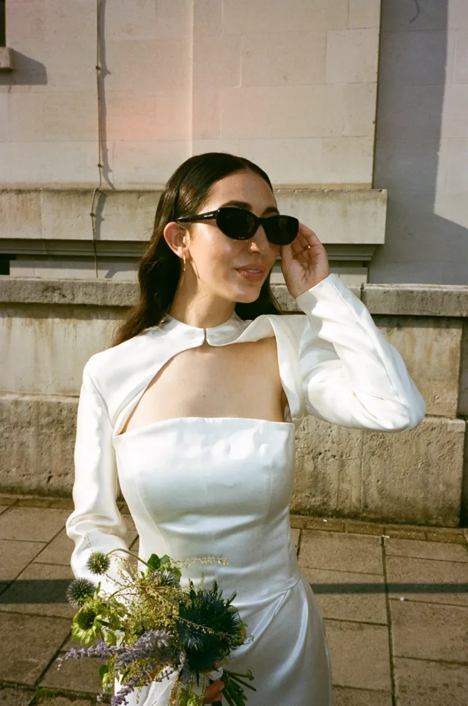 Bride wearing chic sunglasses at her stylish London wedding