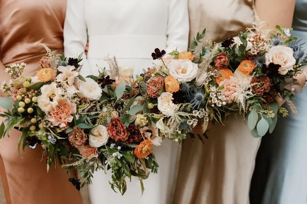 Bridesmaids holding bouquets at a chic micro wedding in London