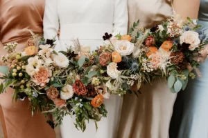 Bridesmaids holding bouquets at a chic micro wedding in London