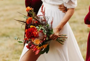 Close-up of vibrant floral bouquet held by bride