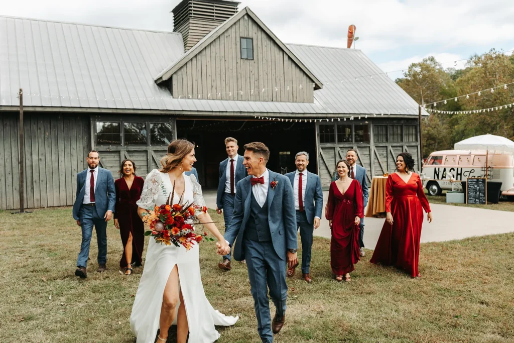 Wedding party walking together after outdoor boho chic wedding