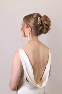 Close-up of a bridal updo with pearl hairpiece