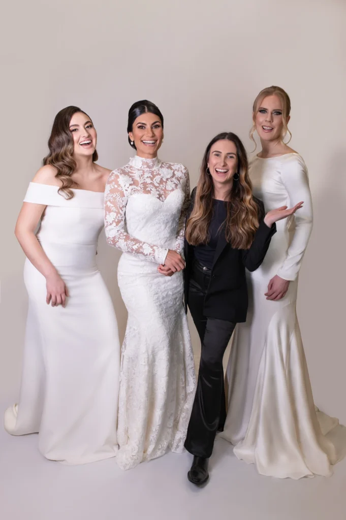 Bridal photoshoot featuring three brides in white gowns with their stylist