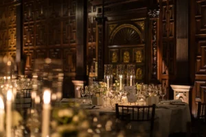 Candlelit dining table adorned with elegant winter-themed decor, setting a magical reception atmosphere.