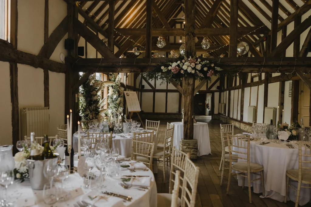 Loseley Park wedding reception with rustic décor and floral accents