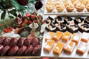 Close-up of luxurious wedding desserts with figs, berries, and caramel bites at Nutfield Priory.