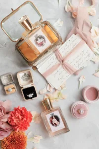 Luxurious bridal perfume and ring set styled with vintage elements and pastel florals.