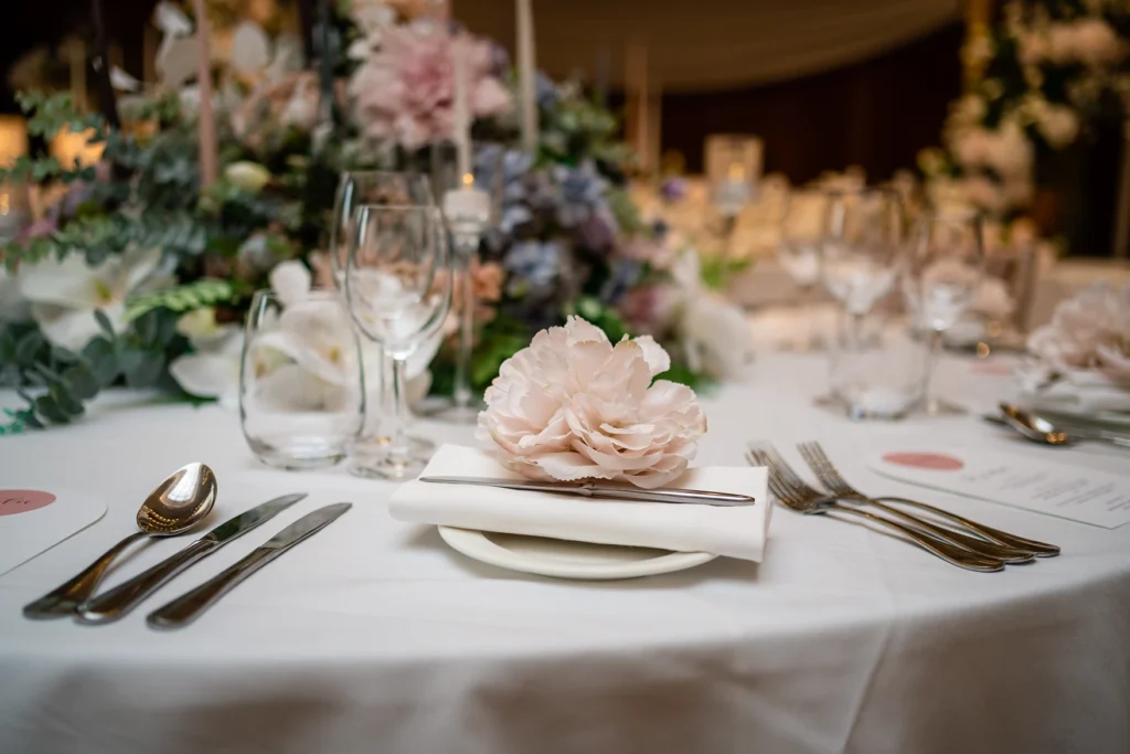 Elegant table setting with floral centerpieces at the Pelham House photoshoot.