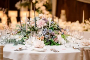 Floral centerpiece with pastel flowers at the Pelham House photoshoot.