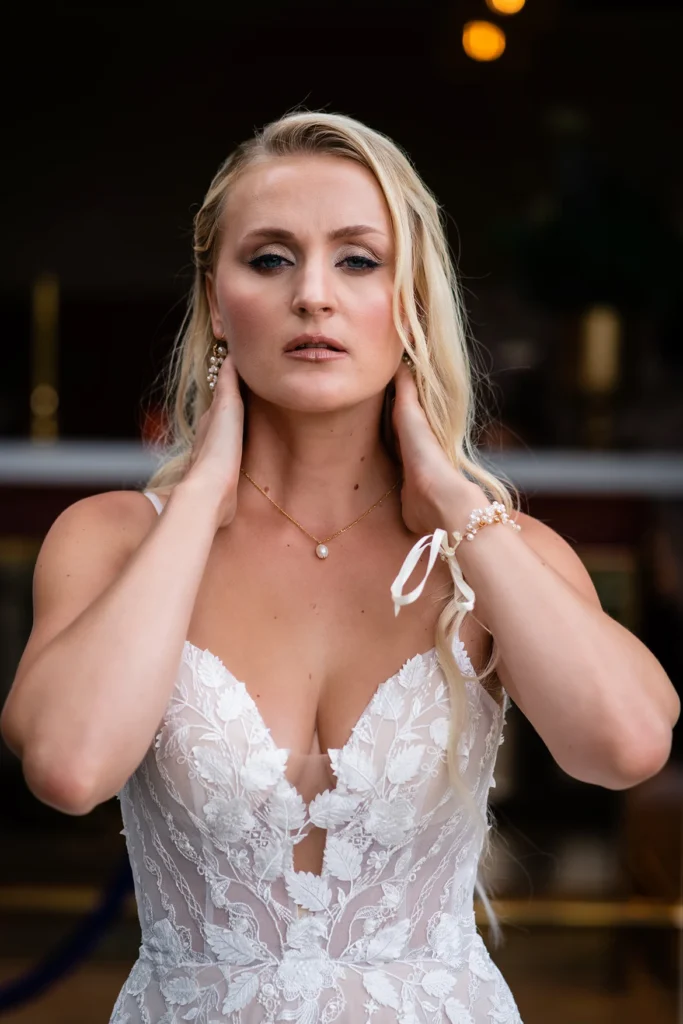 Close-up of bride in intricate lace gown at Pelham House