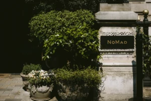 Entrance to NoMad London with lush greenery – perfect setting for a minimalist wedding in London.