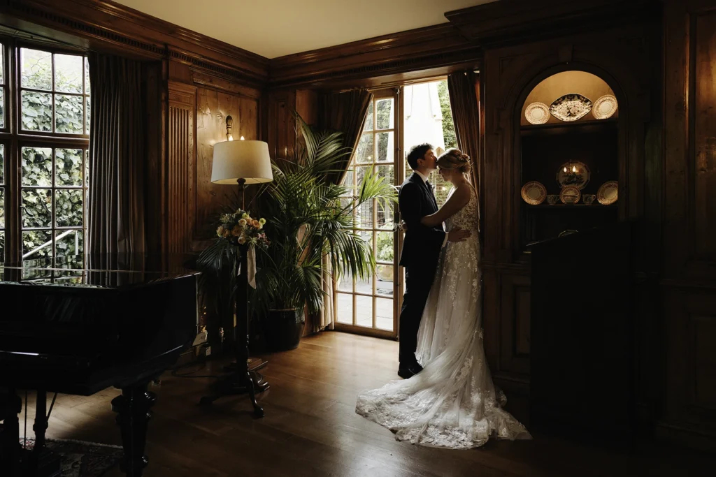 Bride and groom sharing an intimate moment indoors