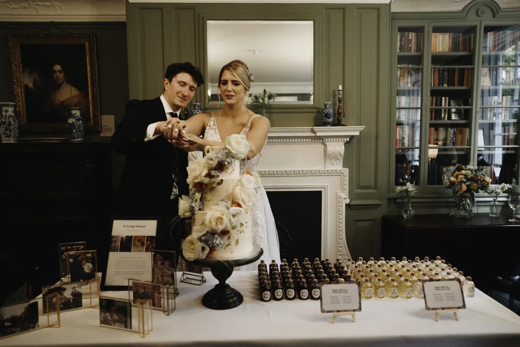 Bride and groom cutting their wedding cake