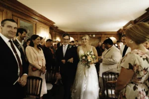 Bride Walking Down the Aisle Surrounded by Guests