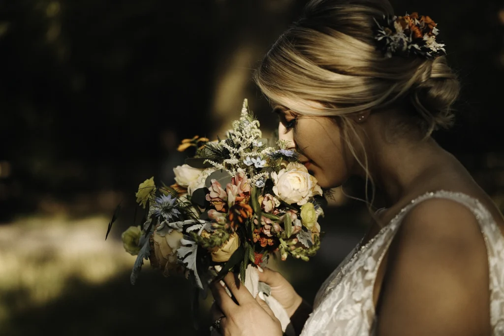 Bride smelling her bouquet