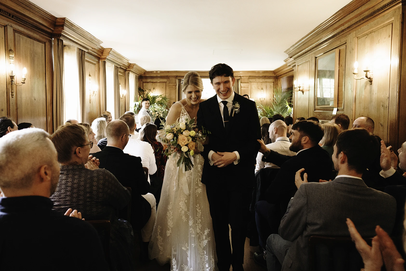 Bride and Groom Celebrating Exit from Ceremony