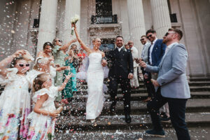 Newlyweds showered in confetti on chic wedding steps