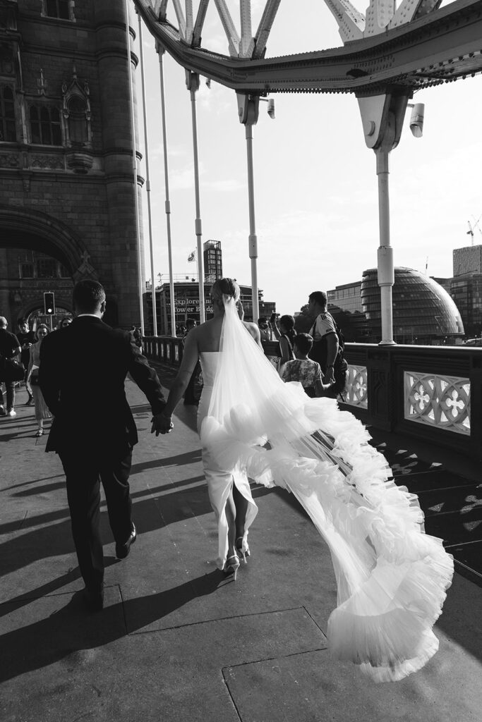 Bride's flowing veil captured on Tower Bridge