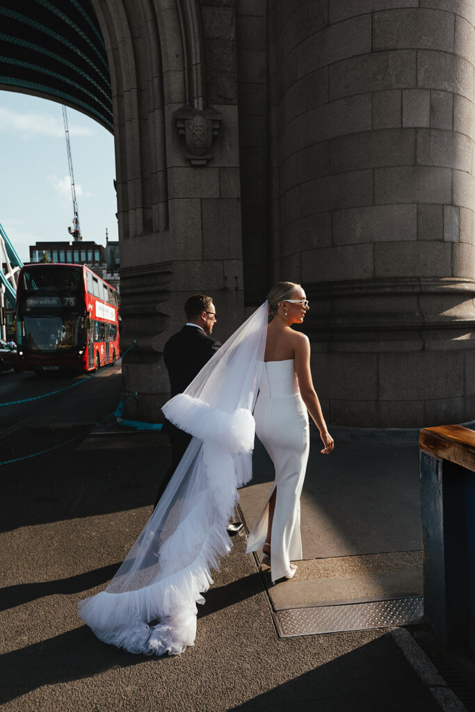 Modern bride and groom with iconic London double-decker in the background