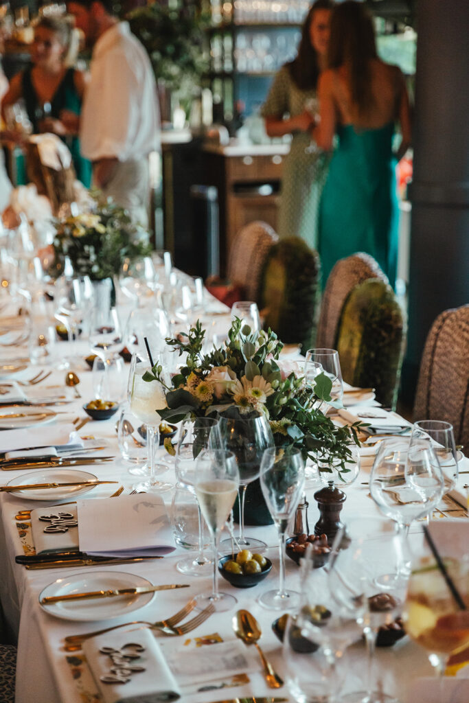 Elegant wedding reception table with floral centrepiece