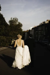 Bride and groom walking hand in hand