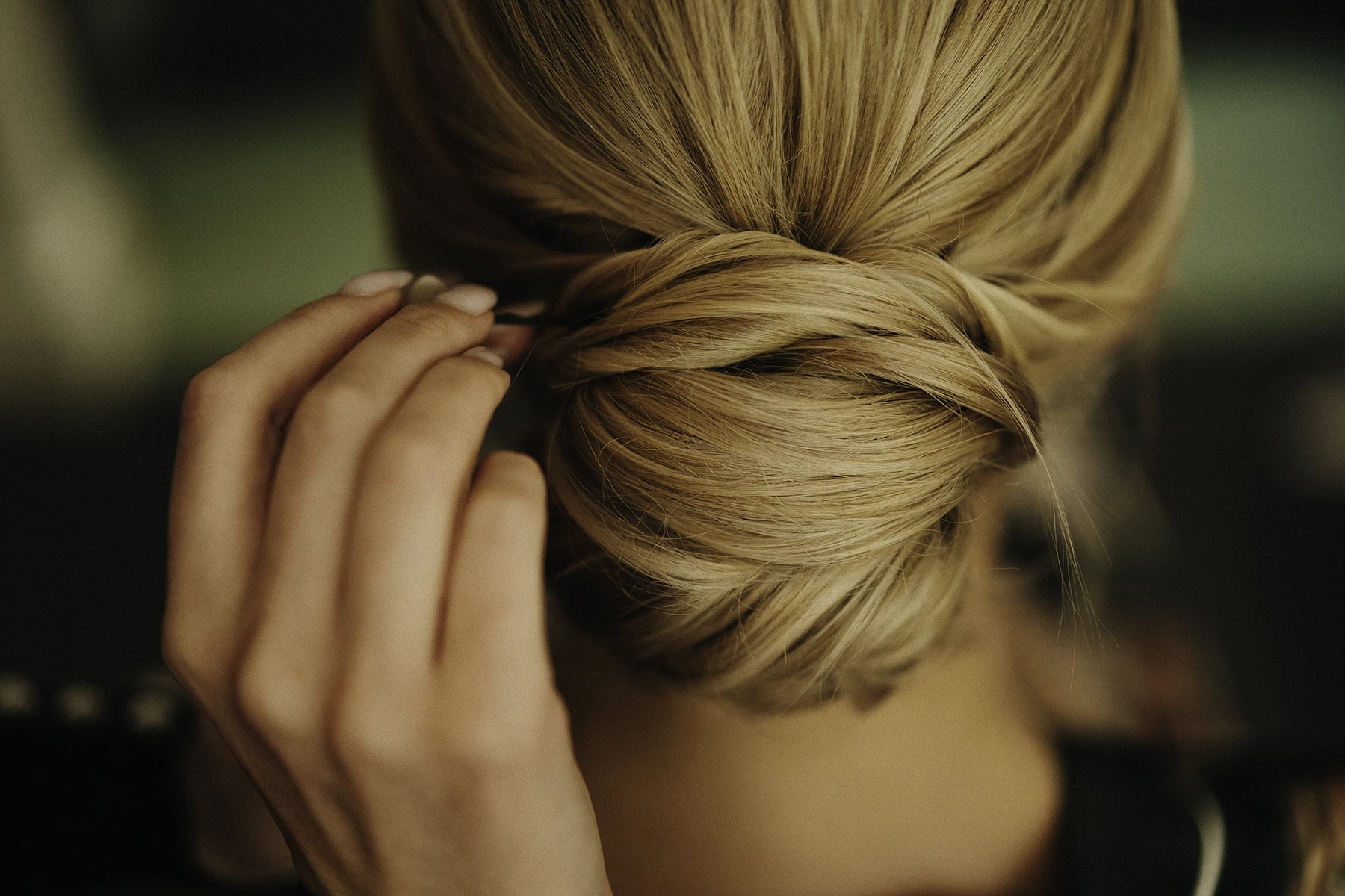 Bride’s elegant updo styled to perfection for her wedding day