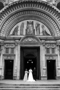 Bride entering historic cathedral for an elegant wedding ceremony