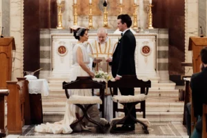 Bride and groom standing before the altar during their wedding ceremony