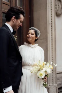 Elegant bride smiling as she steps forward into newlywed life