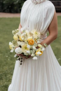 Close-up of a bridal bouquet with yellow and white flowers