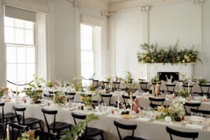 Elegant wedding reception with floral tablescape and candlelit ambiance