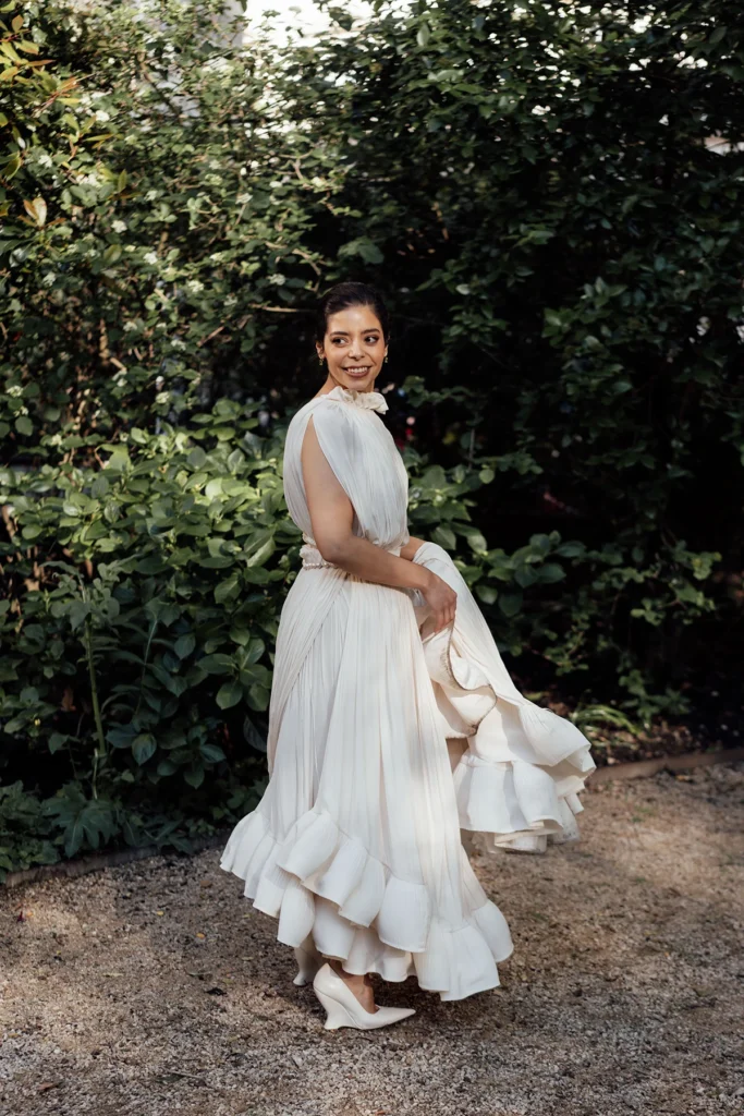 Bride twirling in a flowy gown at her elegant wedding