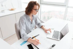 Professional woman planning her wedding while working at a desk