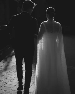 Bride walking with her partner in an elegant evening silhouette