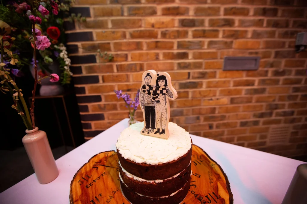 Unique wedding cake with artistic topper