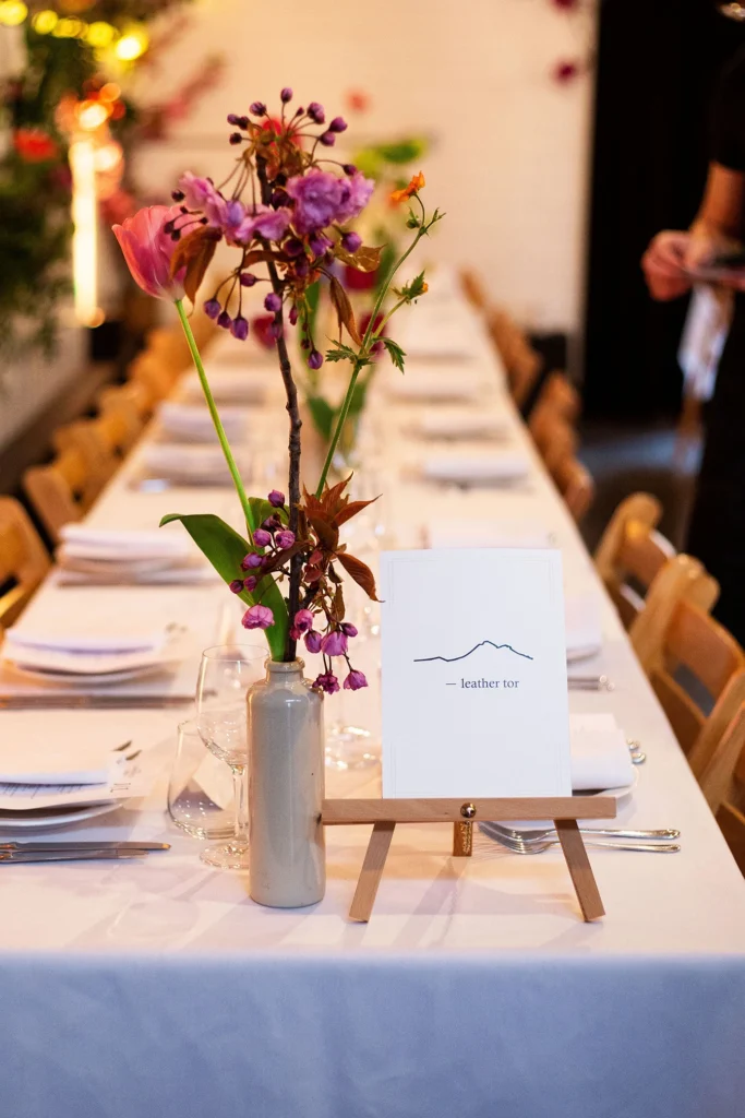 Elegant wedding table setup with floral centrepiece