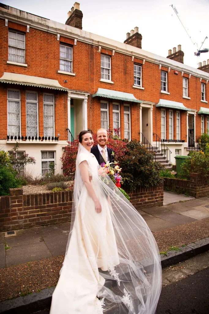 Bride and groom smiling on a London