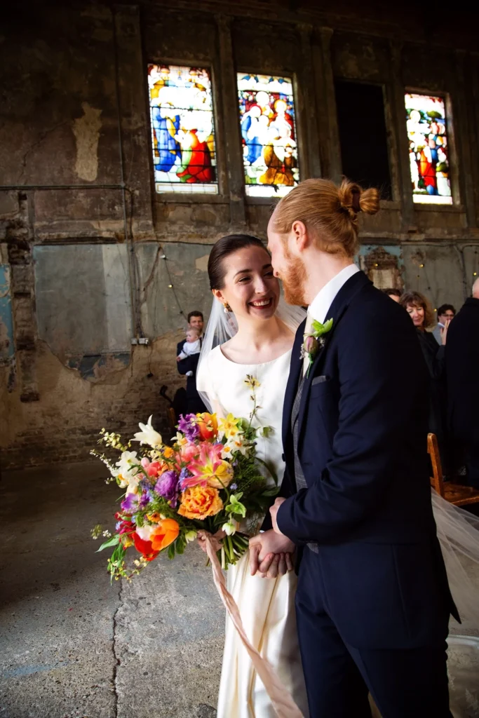 Bride and groom sharing a heartfelt moment inside