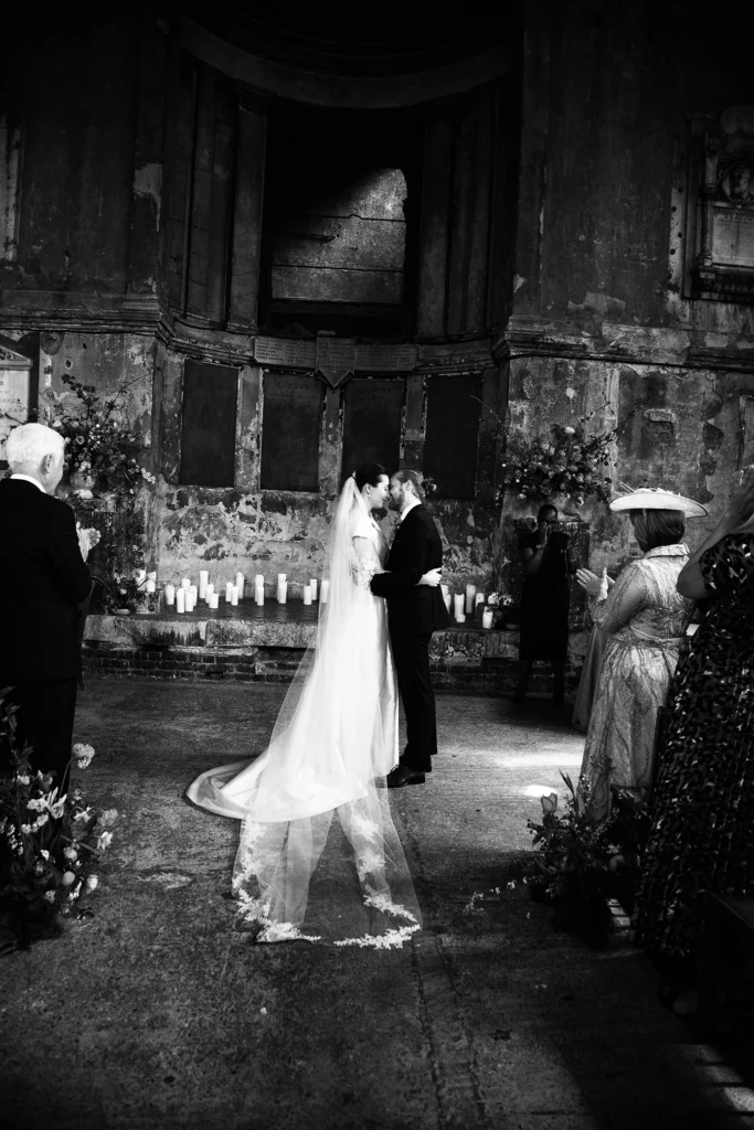 Bride and groom sharing their first kiss