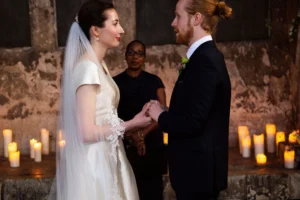 Bride and groom looking into each other’s eyes while exchanging vows