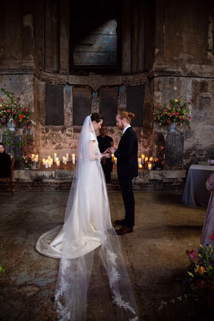 Bride and groom holding hands during their wedding ceremony