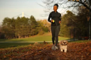 Bride-to-be jogging with her dog to stay fit and relaxed one week before the wedding